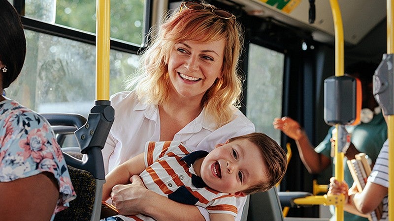 PSI annual report cover showing a woman holding a small child