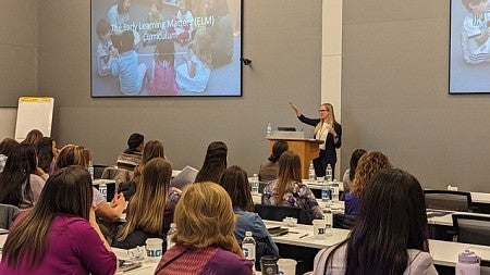 image of professor Sara Schmitt, PhD in classroom of students