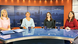panel of women experts sitting and smiling at the camera